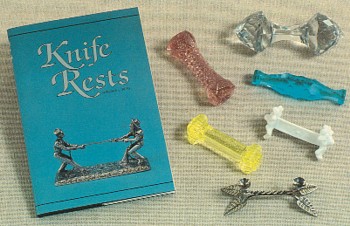 Featured is an image of a postcard picturing antique glass knife rests and promoting the first definitive antiques reference book on the subject by Virginia Neas.  The original unused card is for sale in The unltd.com Store.